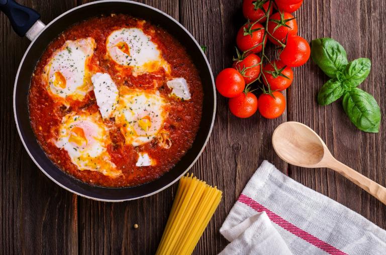 Fried eggs in tomato sauce